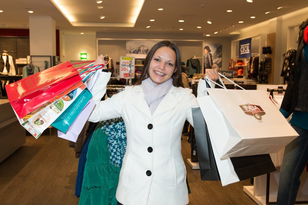 woman with multiple shopping bags