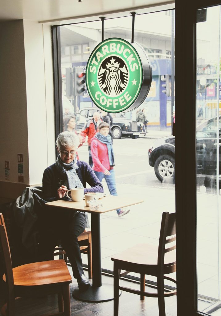 Woman drinking coffee at Starbucks