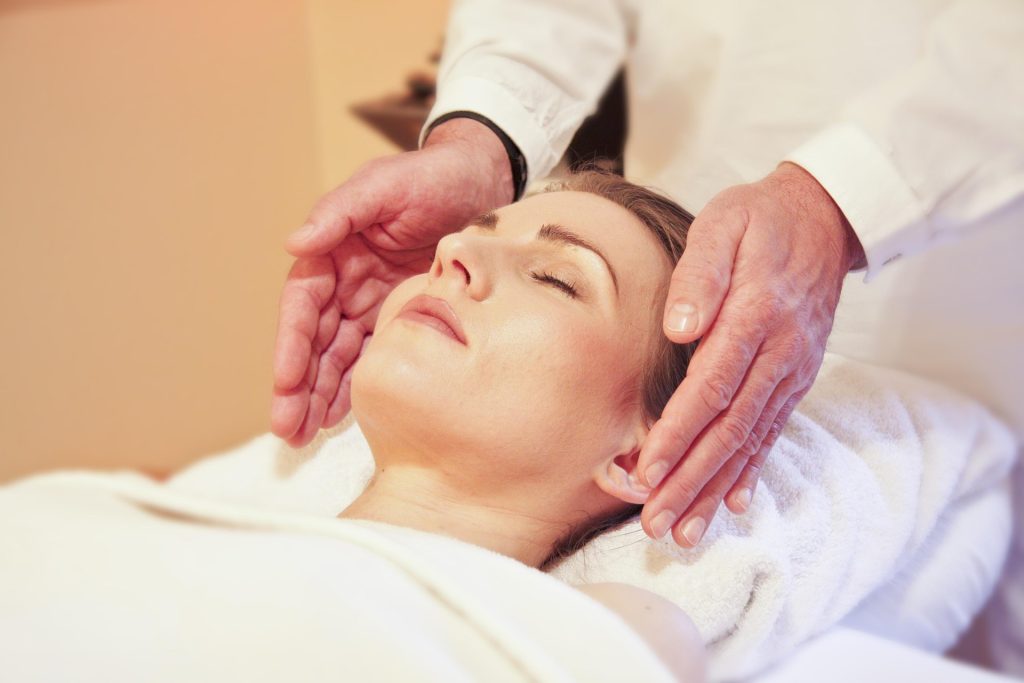 woman receiving Reiki